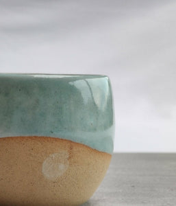 Celadon turquoise round cup, tea cup, coffee cup. Unglazed base.