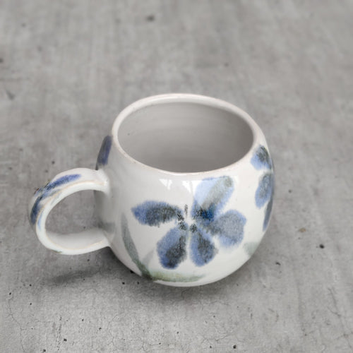 Flowers round espresso coffee cup