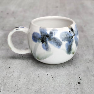 Flowers round espresso coffee cup