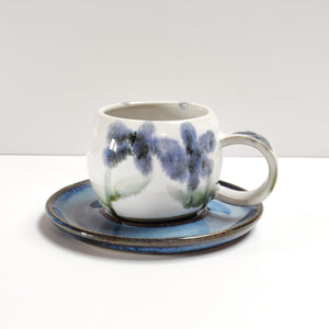 Flowers round espresso coffee cup