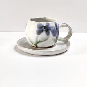 Flowers round espresso coffee cup