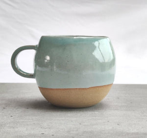 Celadon turquoise round cup, tea cup, coffee cup. Unglazed base.