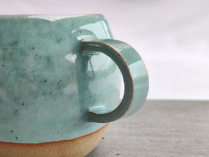 Celadon turquoise round cup, tea cup, coffee cup. Unglazed base.