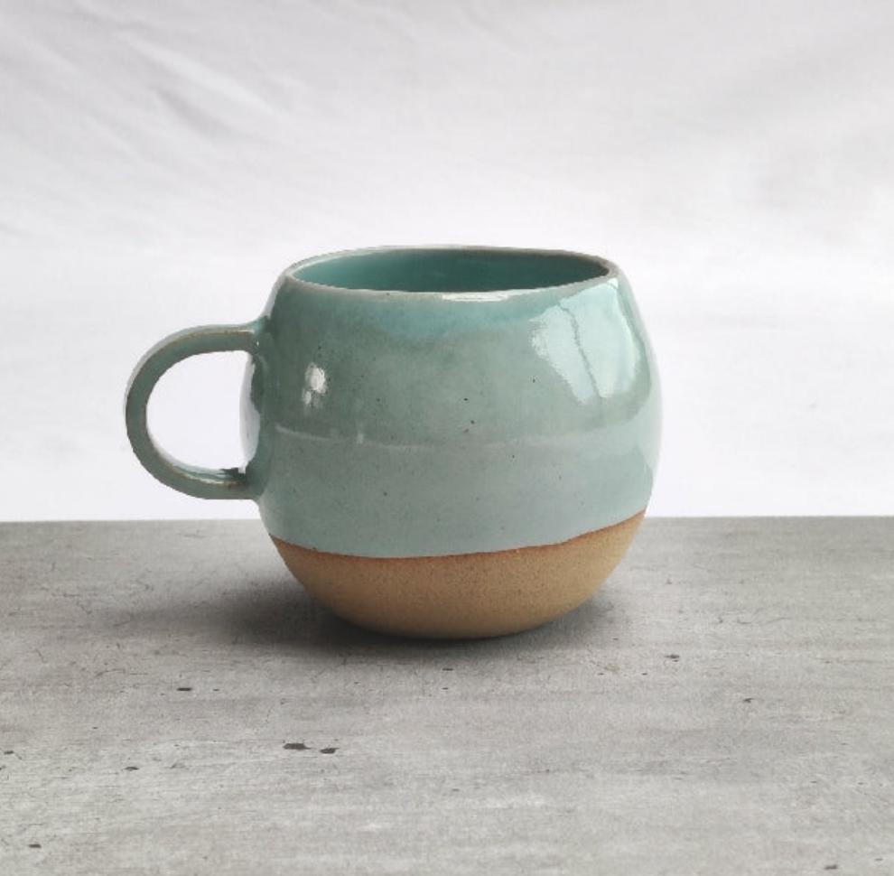 Celadon turquoise round cup, tea cup, coffee cup. Unglazed base.